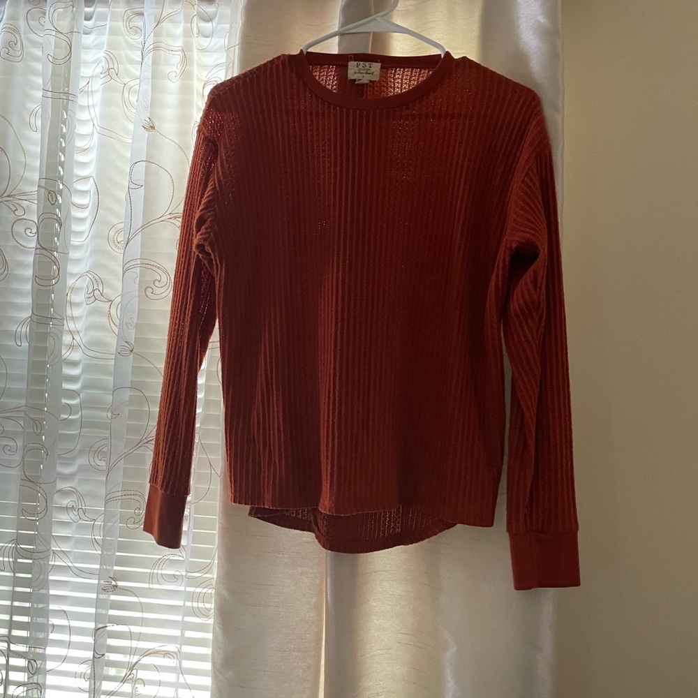 Waffled long sleeve top. Burnt orange in color